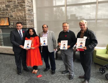 Four man and one women posing with certificates