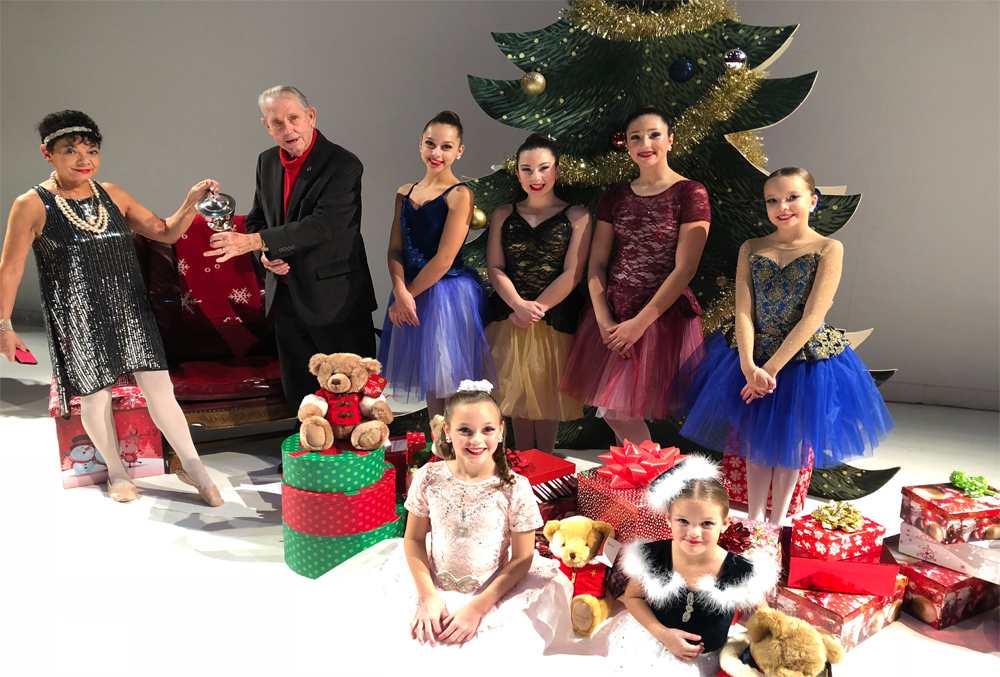 many people smiling and posing